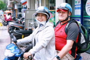 Foreign tourists taking motorbike taxis