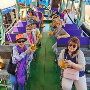 Experience the peaceful journey of rowing a traditional boat along the Mekong River